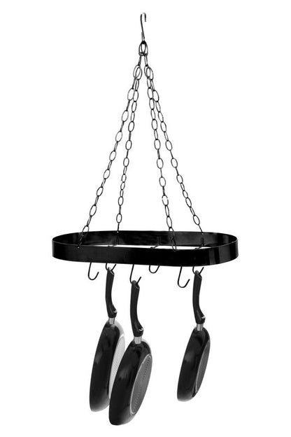 Black metal hanging pan rack with four frying pans on a white background