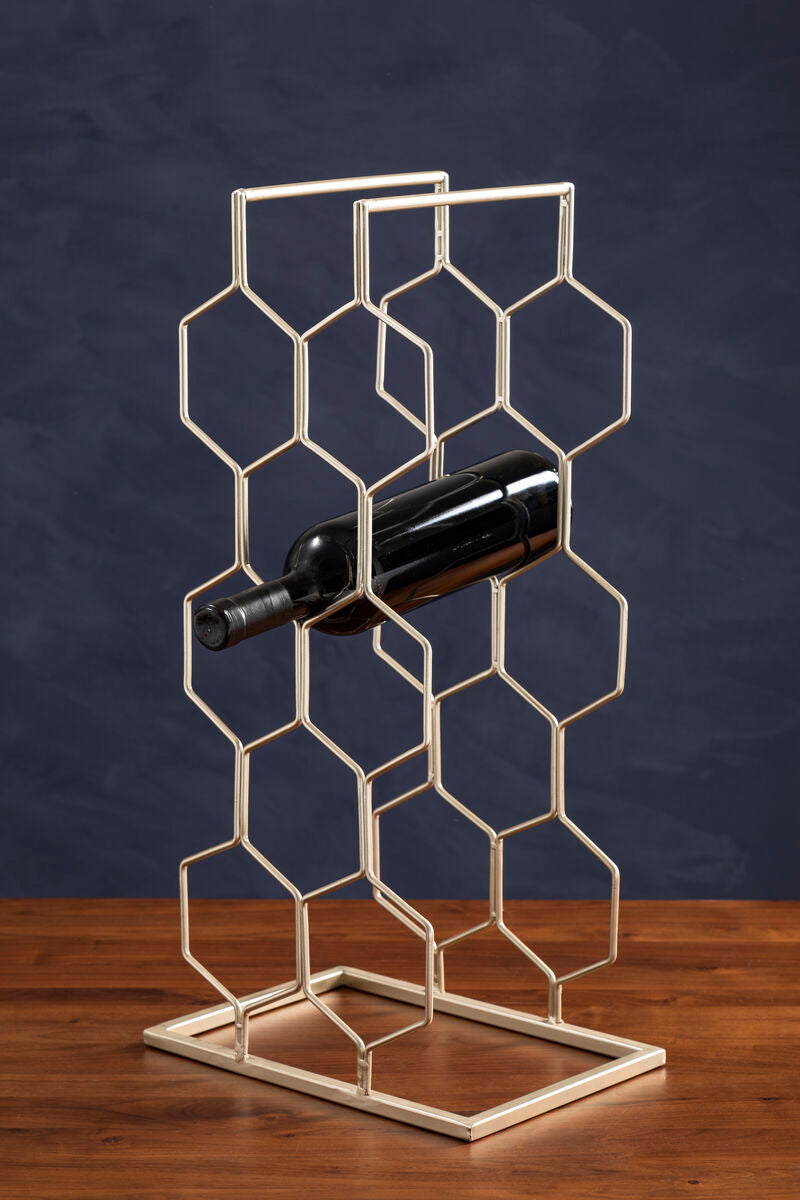 Metal wine rack with a bottle on a wooden surface against a dark background