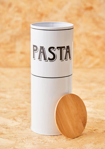 White pasta storage container with wooden lid on a wooden surface