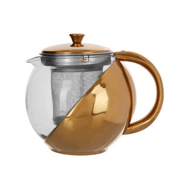 Gold and clear glass teapot with handle on a white background