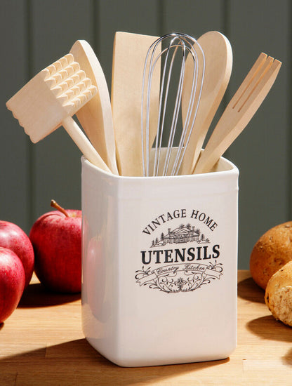 Set of kitchen utensils in a white container with &