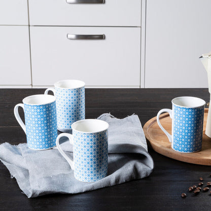 Moka pot with blue patterned mugs on a wooden tray in a kitchen setting.