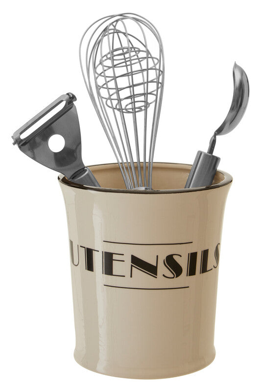 Beige utensil holder with kitchen tools including a whisk, peeler, and ladle on a white background.