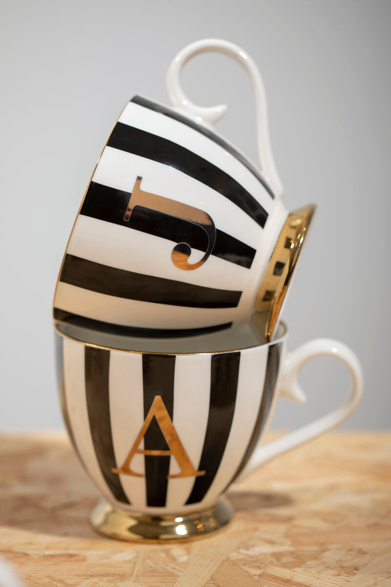 Black and white striped mug with gold letter &