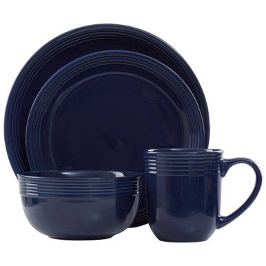 Navy blue dinnerware set including plates and a mug on a white background
