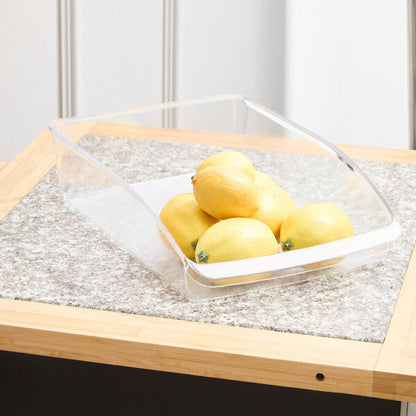 Clear container with lemons on a wooden table