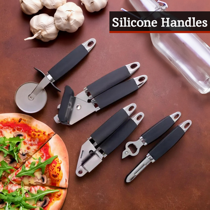 Set of kitchen tools with silicone handles on a brown surface with garlic and pizza.