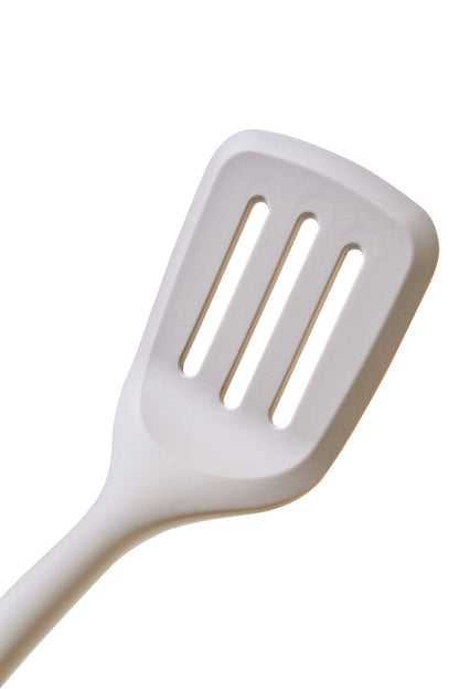 White slotted spatula on a white background