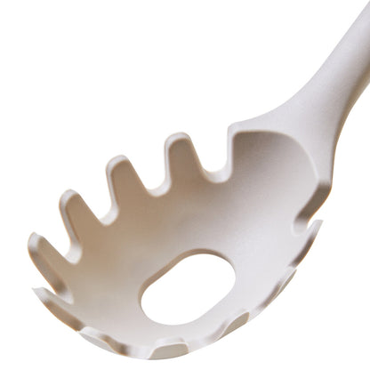 Close-up of a white pasta server on a white background