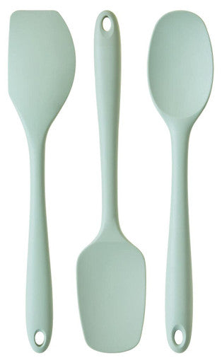 Three light green silicone utensils on a white background