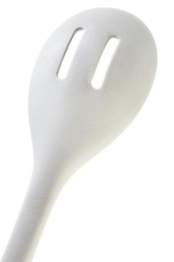 White slotted spoon on a white background