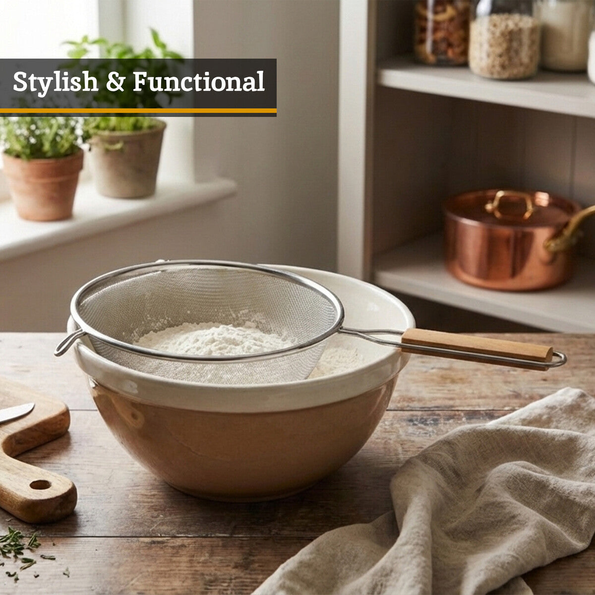 Bowl with a sifter on a wooden table in a kitchen setting