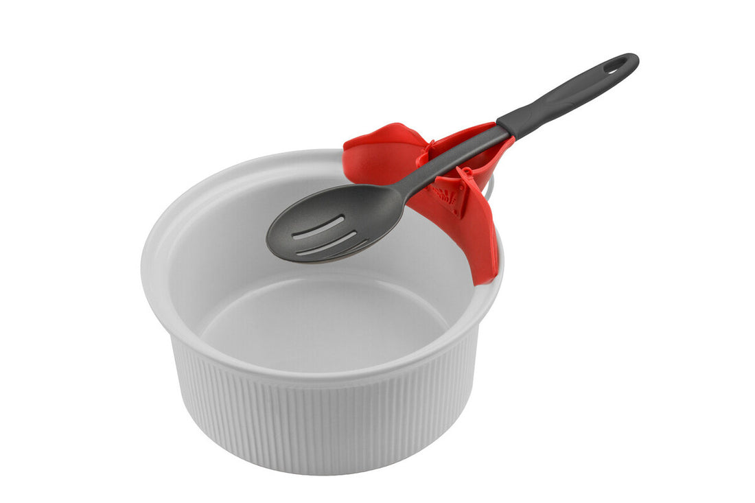 White bowl with a gray spoon and red holder on a white background