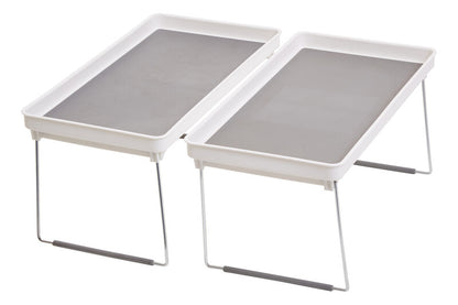 Two white trays with gray mesh on a white background