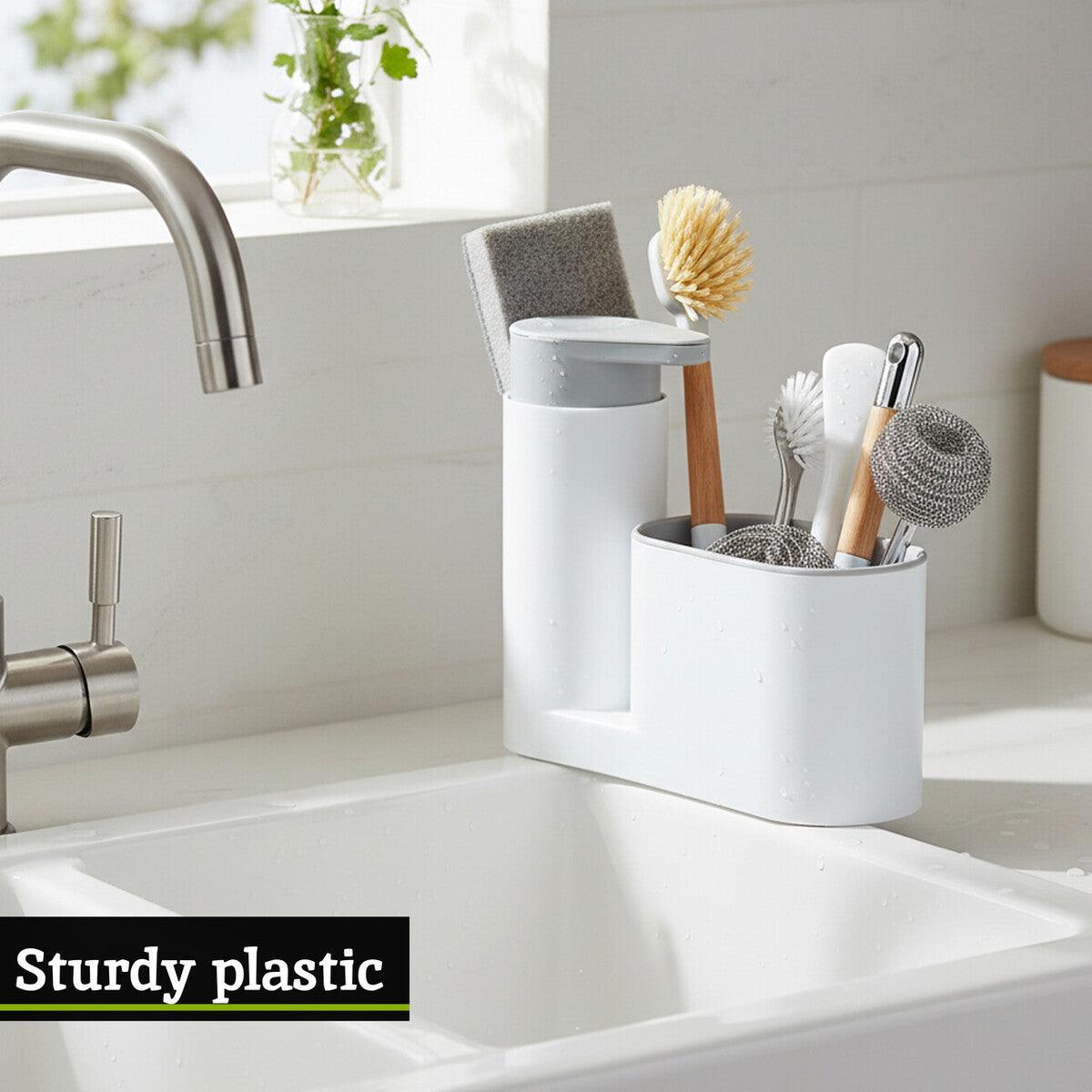 White kitchen utensil holder with cleaning tools on a kitchen counter