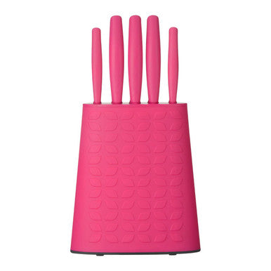 Set of pink kitchen knives in a matching pink block on a white background