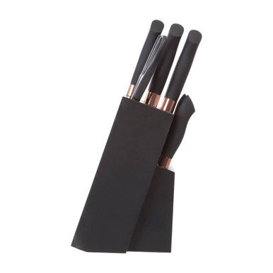 Set of makeup brushes in a black holder on a white background