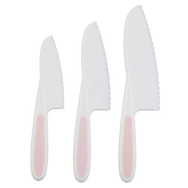Three knives with white handles on a white background