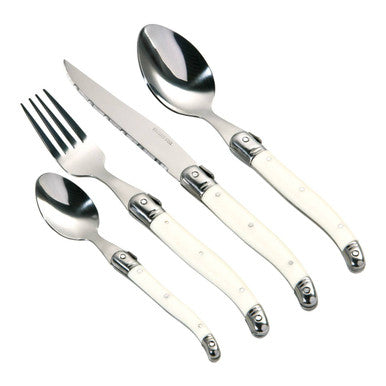 Set of silver cutlery with white handles on a white background