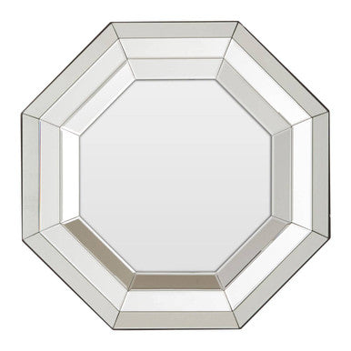 Octagonal mirror with a silver frame on a white background