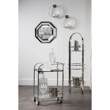 Decorative glass shelves and mirror on a white wall.
