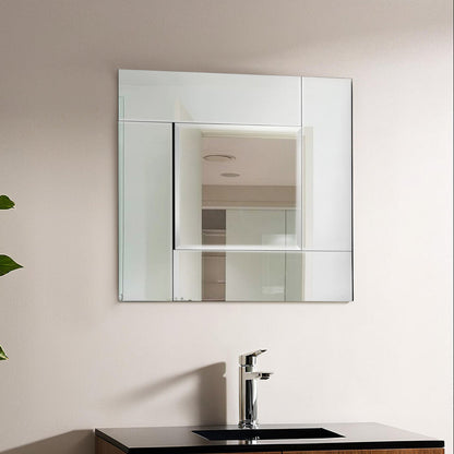 Bathroom vanity with mirror and sink, featuring a plant on the side.