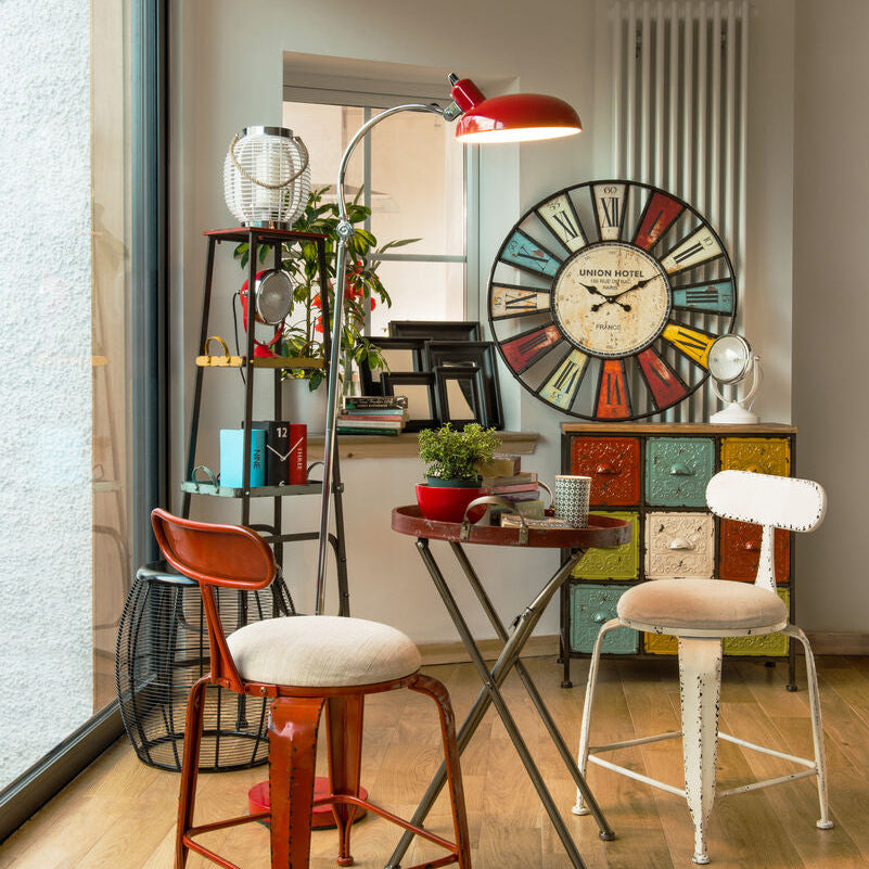 Modern interior with colorful furniture and decorative clock on the wall.