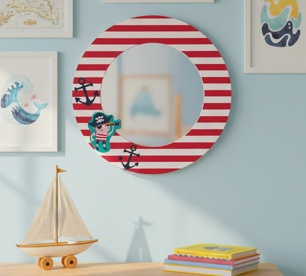 Nautical-themed wall decor with a striped mirror and framed illustrations on a light blue wall.