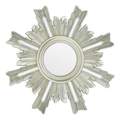 Decorative round mirror with a sunburst design on a white background