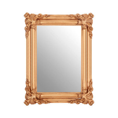 Decorative gold mirror with intricate patterns on a white background