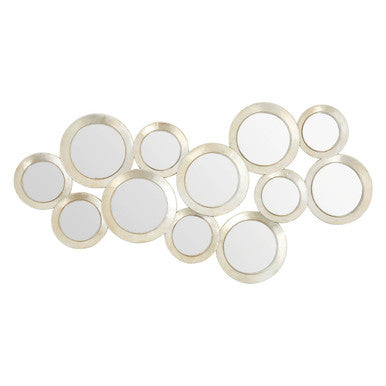 Decorative wall mirror with circular mirrors in gold frames on a white background