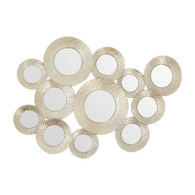 Decorative wall art with circular mirrors in gold and white on a white background