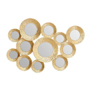 Decorative wall art with gold circular mirrors on a white background