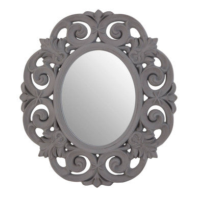 Decorative oval mirror with intricate patterns on a white background