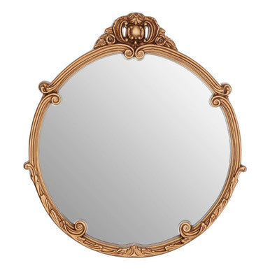 Decorative gold-framed mirror on a white background