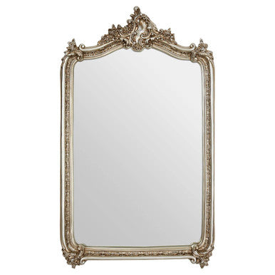 Decorative wall mirror with ornate frame on a white background