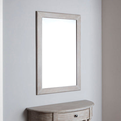 Wooden console table with a mirror on a light gray wall