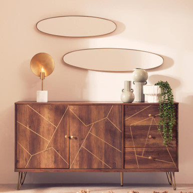Wooden sideboard with geometric design in a room with decorative elements.