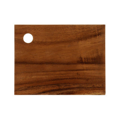 Wooden cutting board with a circular hole on a white background