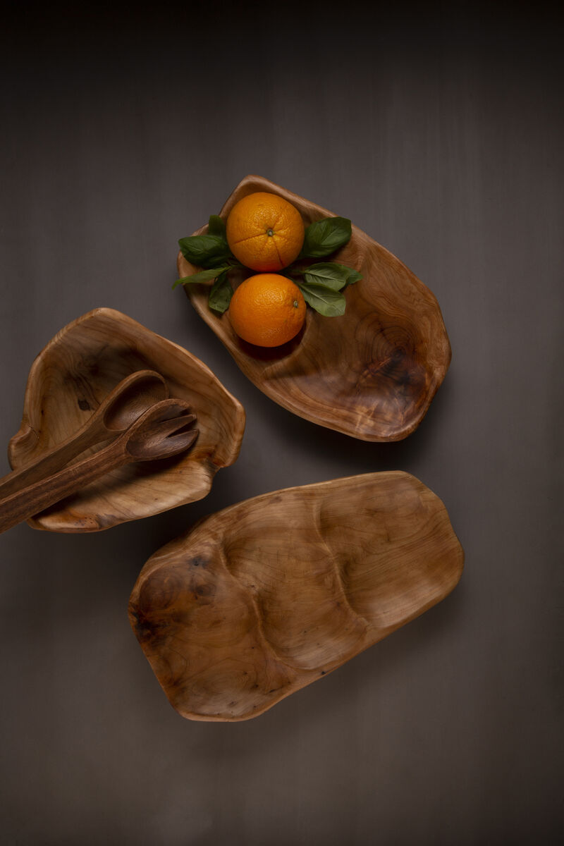 Three wooden bowls with oranges on a dark background