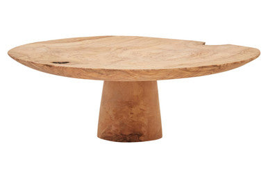 Wooden table with a round top and thick base on a white background