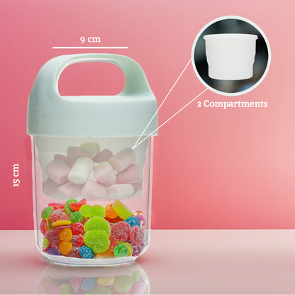 Transparent container with handle filled with colorful gummy candies on a pink background