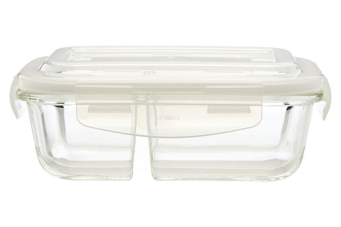 Clear glass food container with a lid on a white background