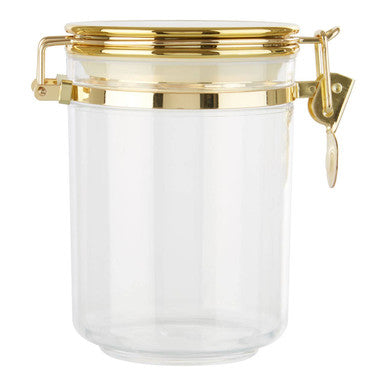 Clear glass jar with a gold lid on a white background