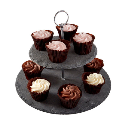 Three-tiered slate cake stand with cupcakes on a white background