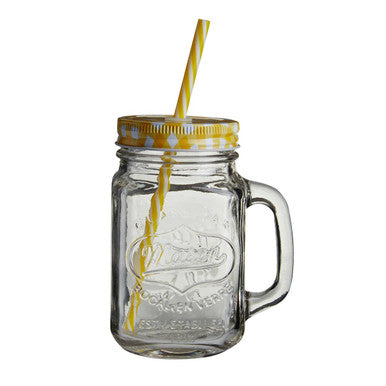 Clear glass mason jar with handle, yellow lid, and straw on a white background