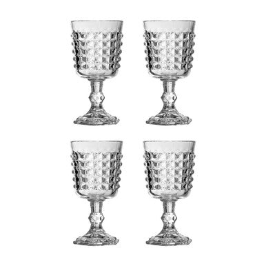 Set of four clear glass goblets with textured design on a white background