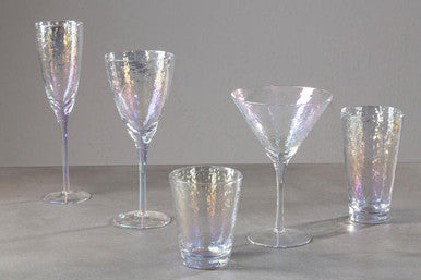 Set of five iridescent glassware on a gray background