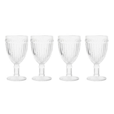 Set of four clear glass goblets on a white background