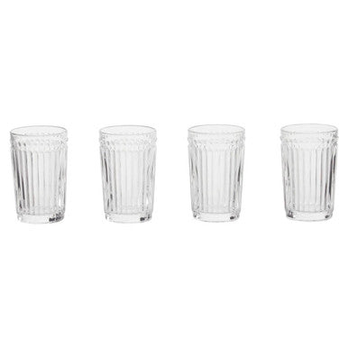Set of four clear glass tumblers with vertical ridges on a white background